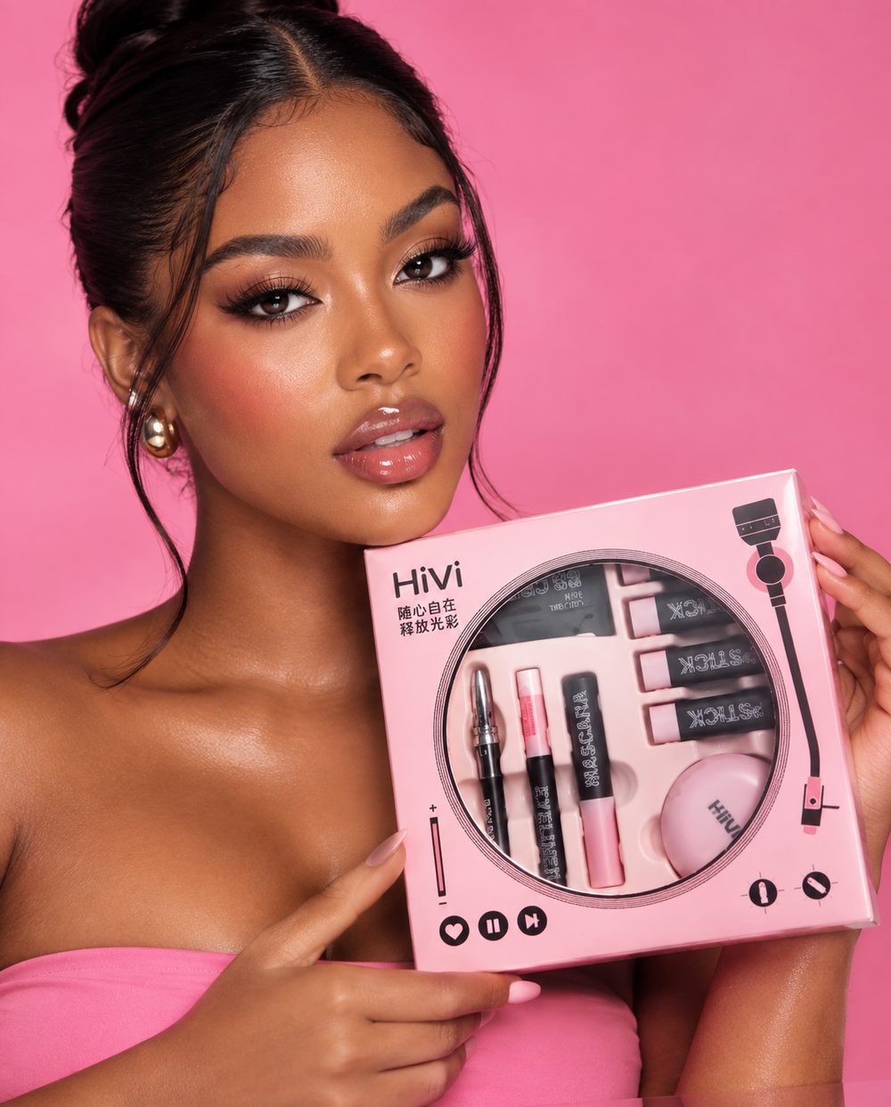 Model holding the Umbrella's Beauty Glam Edit gift set